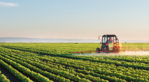 Tractor in a green pasture